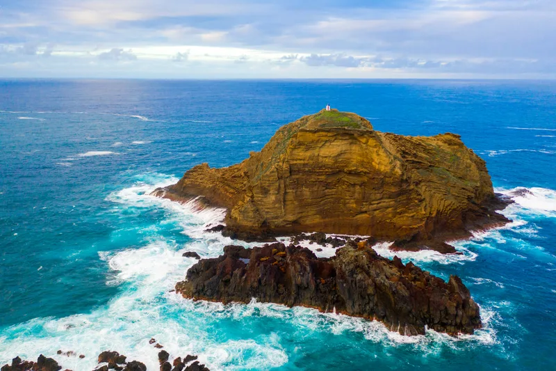 Aerial Shot Cliff Near Sea With Waves Splashing