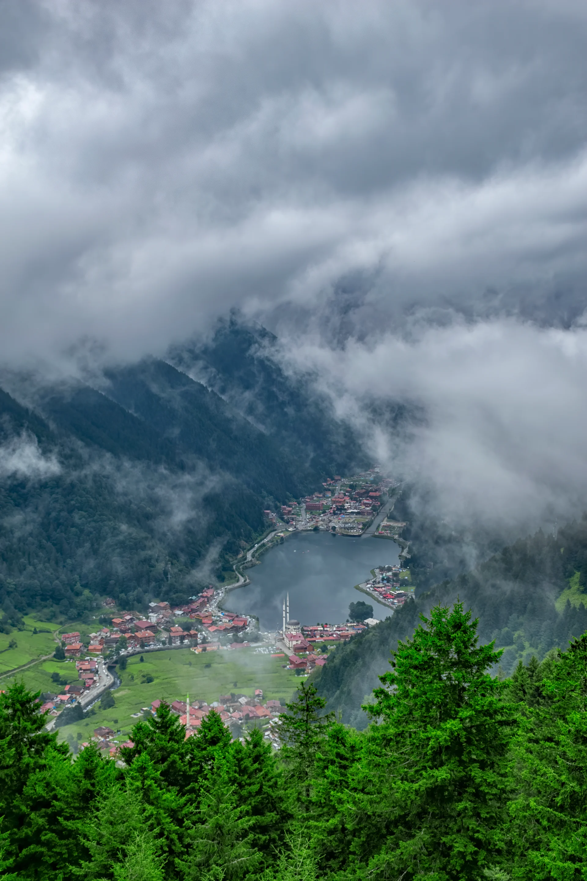 Aerial View Town Against Cloudy Sky. Aerial wallpaper. 4000×6000px. Free download for personal use.