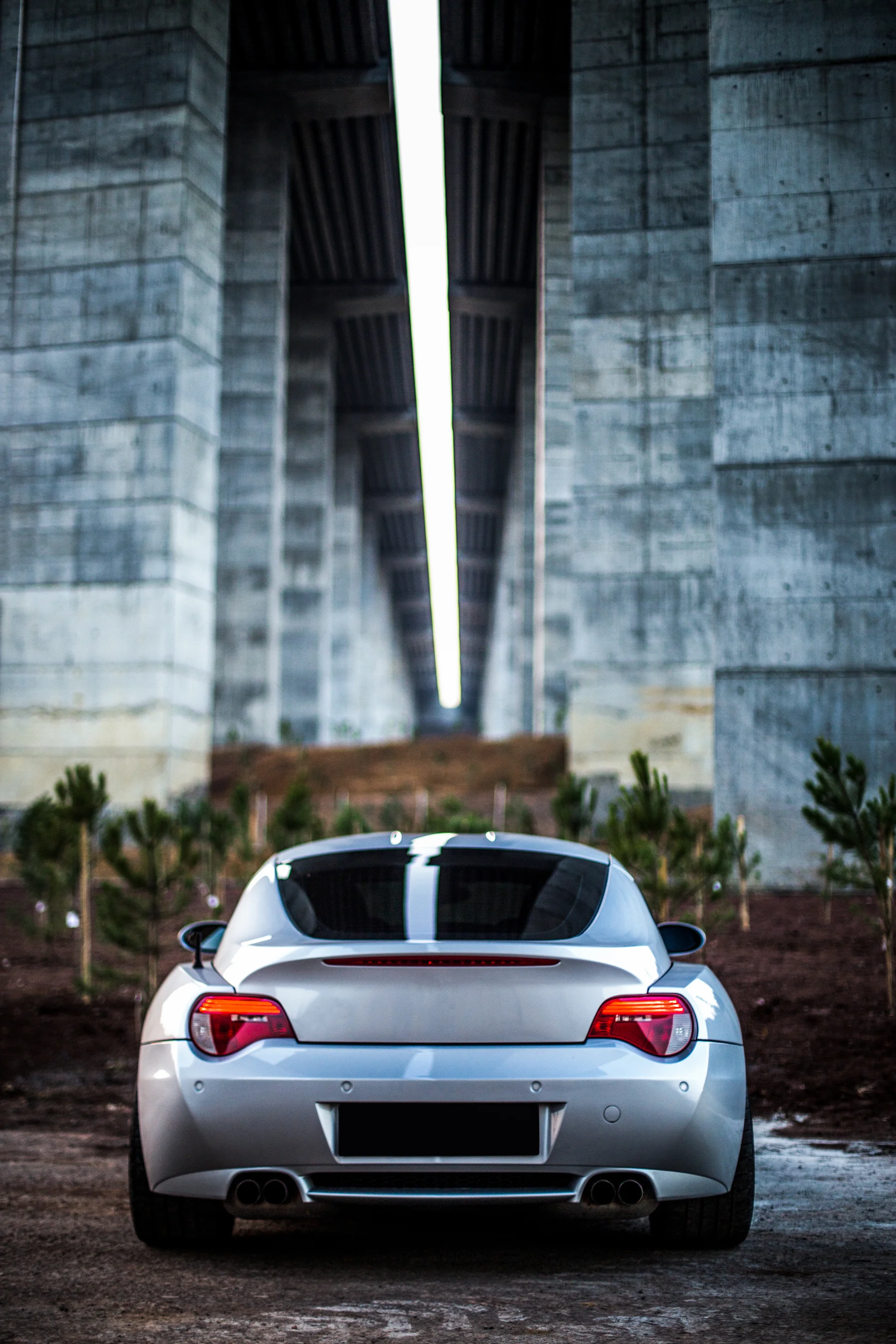 Back View Silver Sport Sedan With Red Lights. Cars wallpaper. 3648×5472px. Free download for personal use.