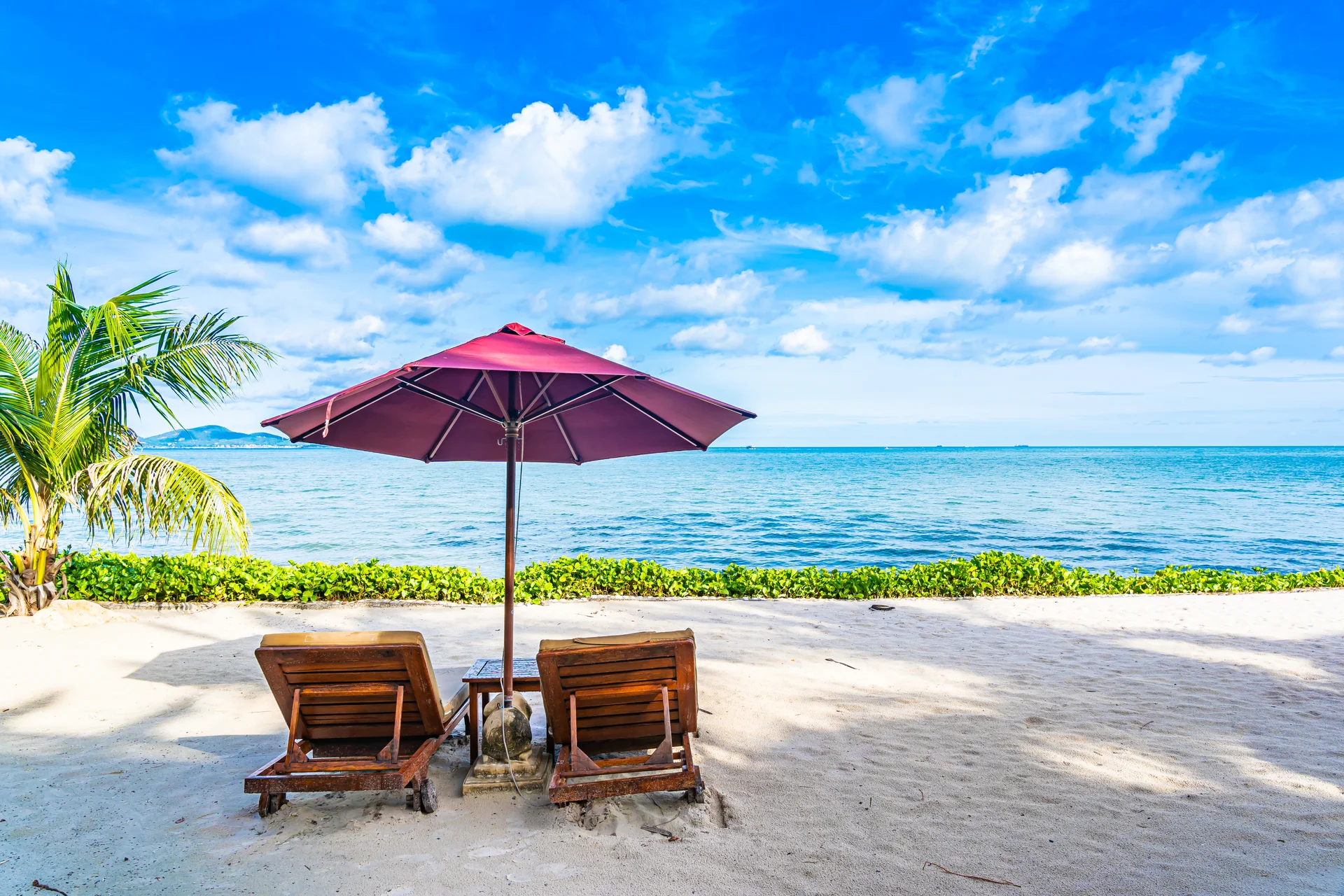 Beautiful Landscape Beach Sea Ocean With Empty Chair Deck Umbrella Nearly Coconut Palm Tree With White Cloud Blue Sky. Nat…