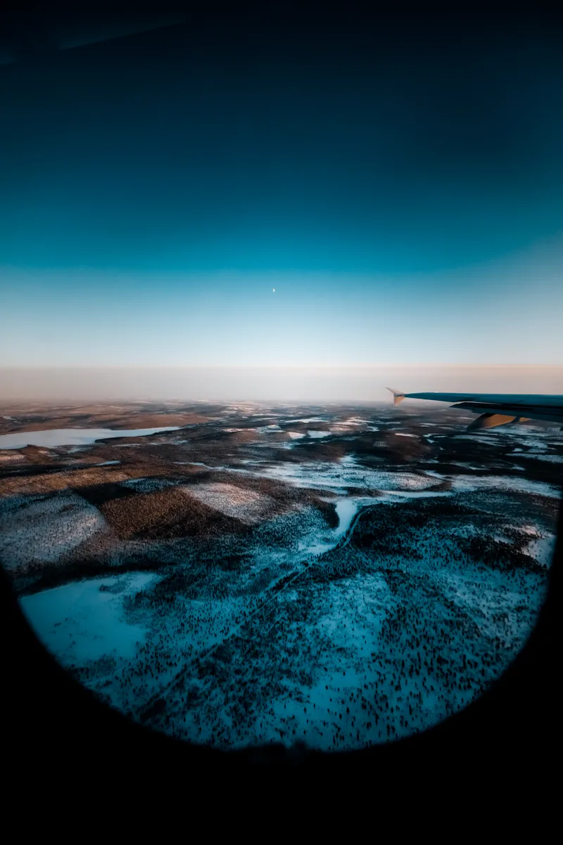 Beautiful Shot Airplane Wing Through Window Snow Covered Landscape