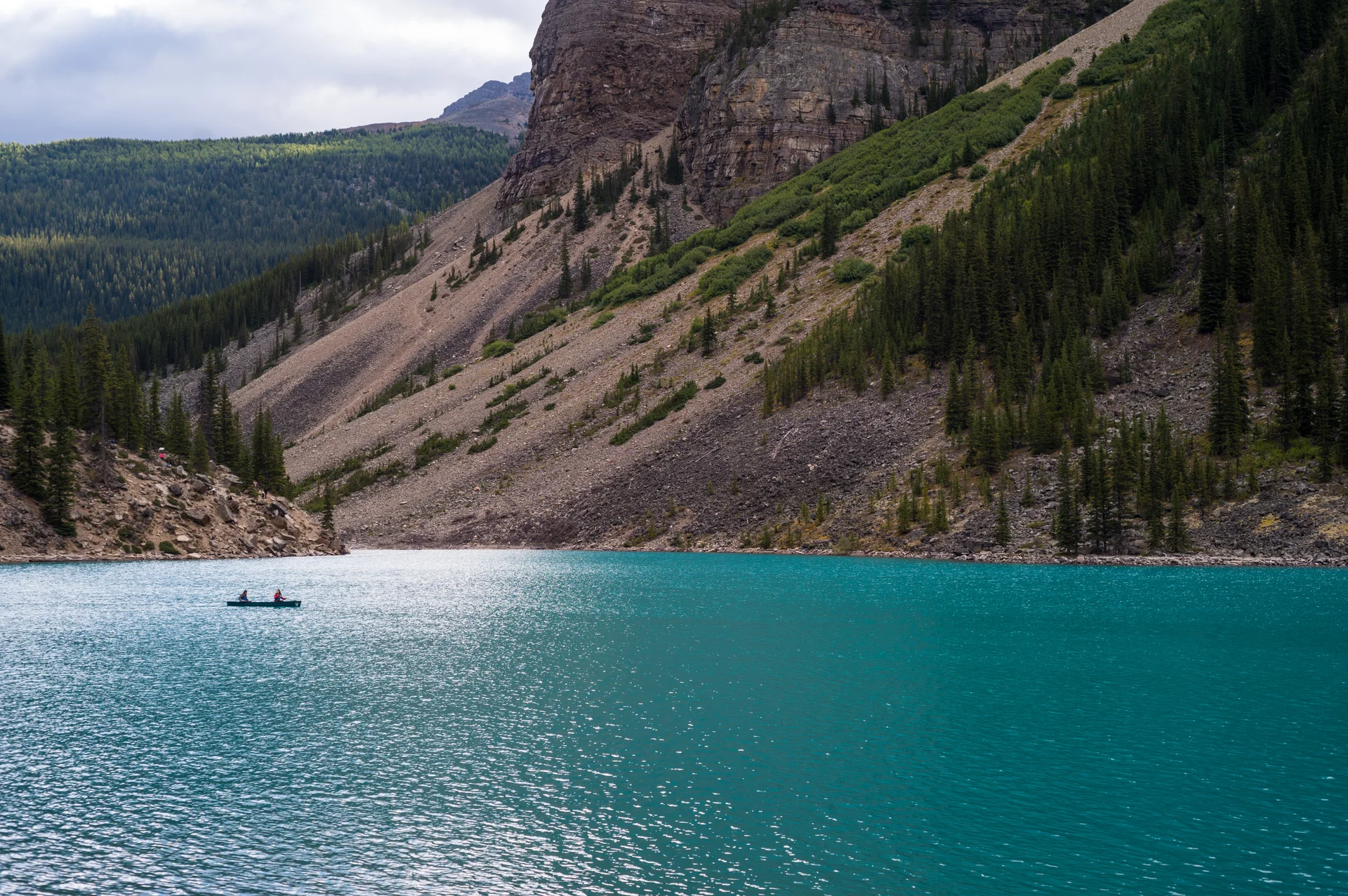 Beautiful Shot Blue Lake Near Mountains Gloomy Day. Nature wallpaper. 6048×4024px. Free download for personal use.