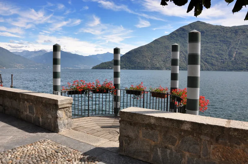Beautiful View Floral Handrailings Pier By Ocean Near Mountains