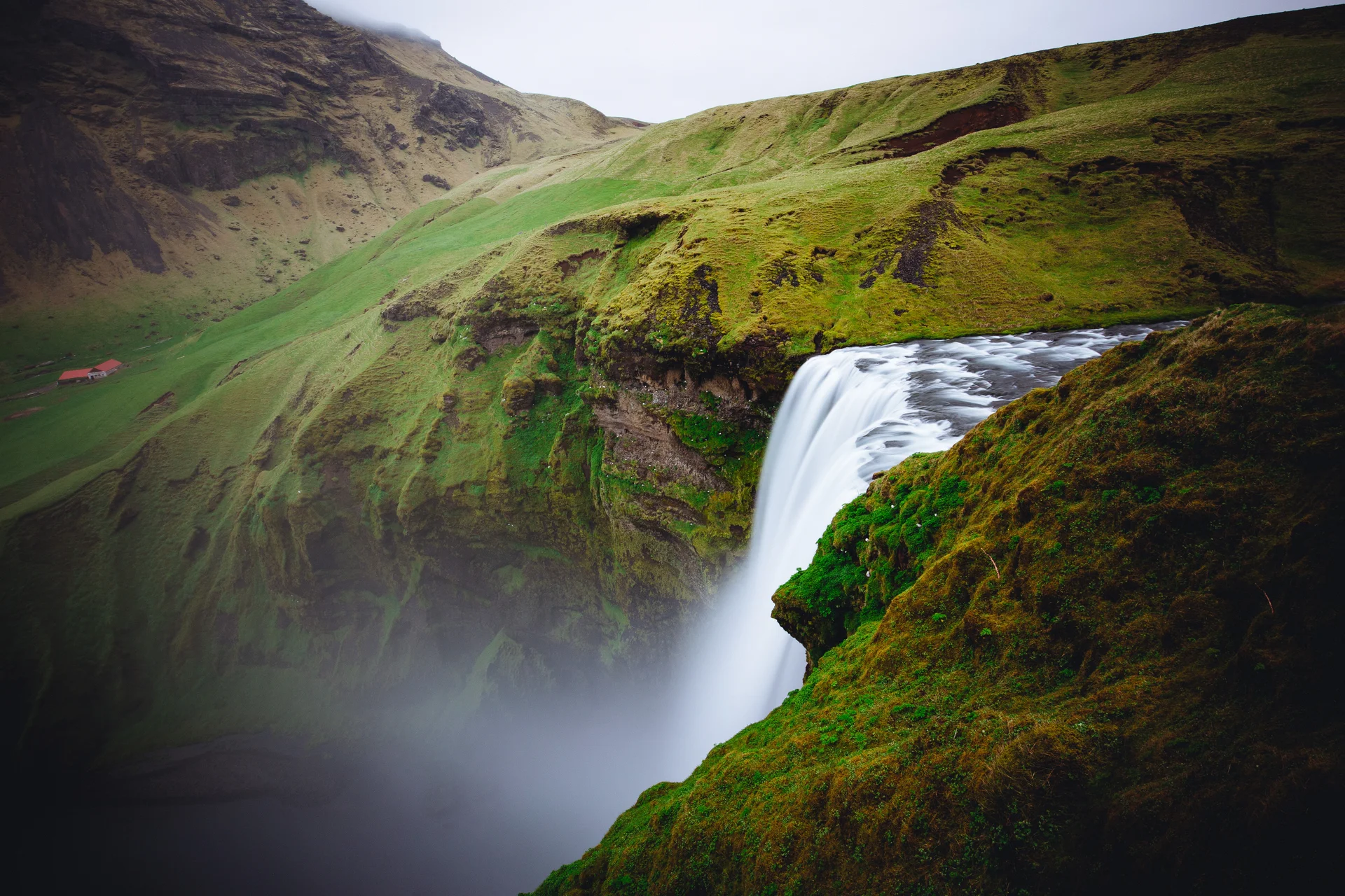 Beautiful Waterfall Green Hills Skogafoss Iceland. Nature wallpaper. 5472×3648px. Free download for personal use.
