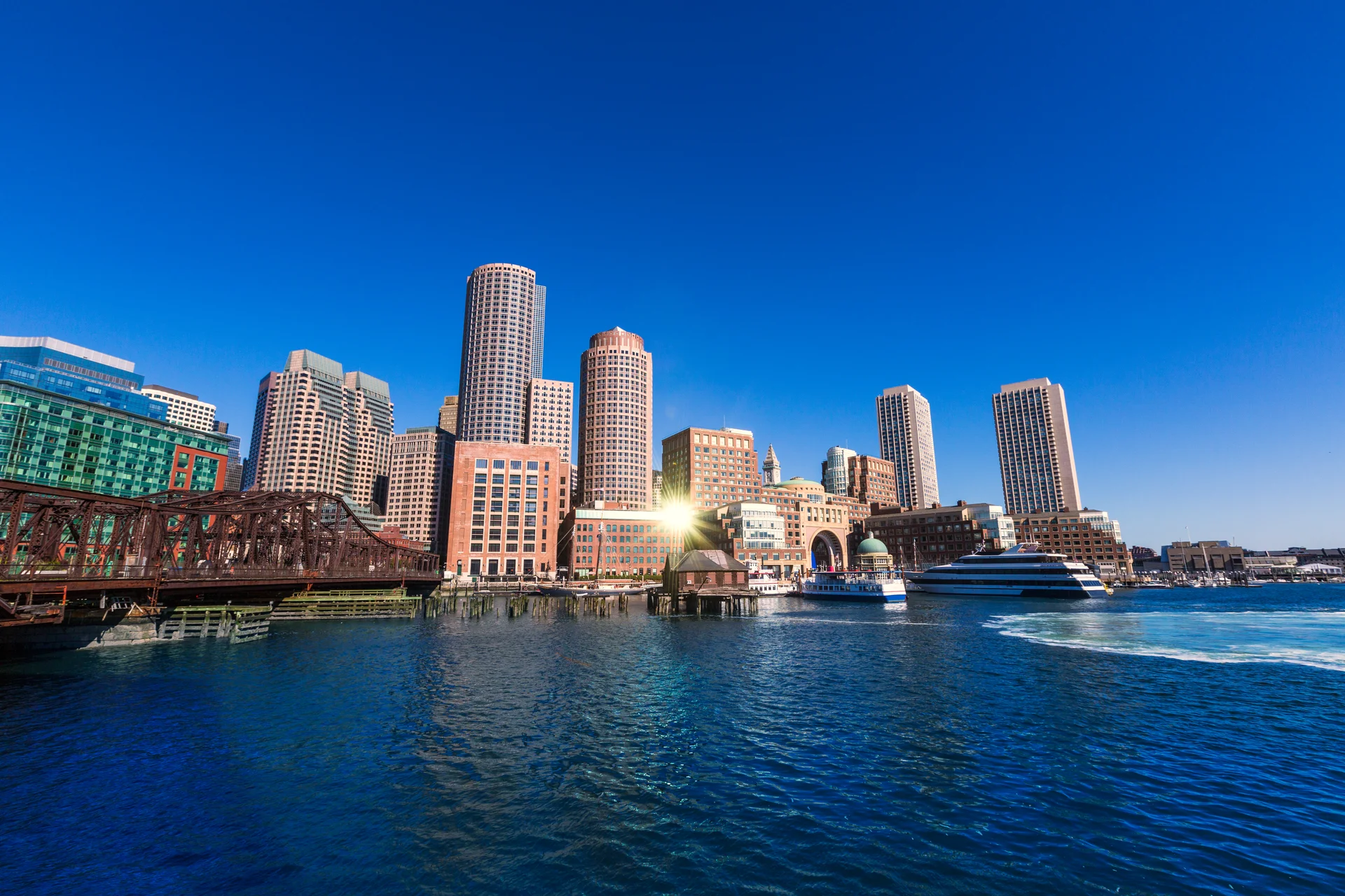 Boston Skyline From Fan Pier Sunlight Massachusetts. Aerial wallpaper. 5760×3840px. Free download for personal use.