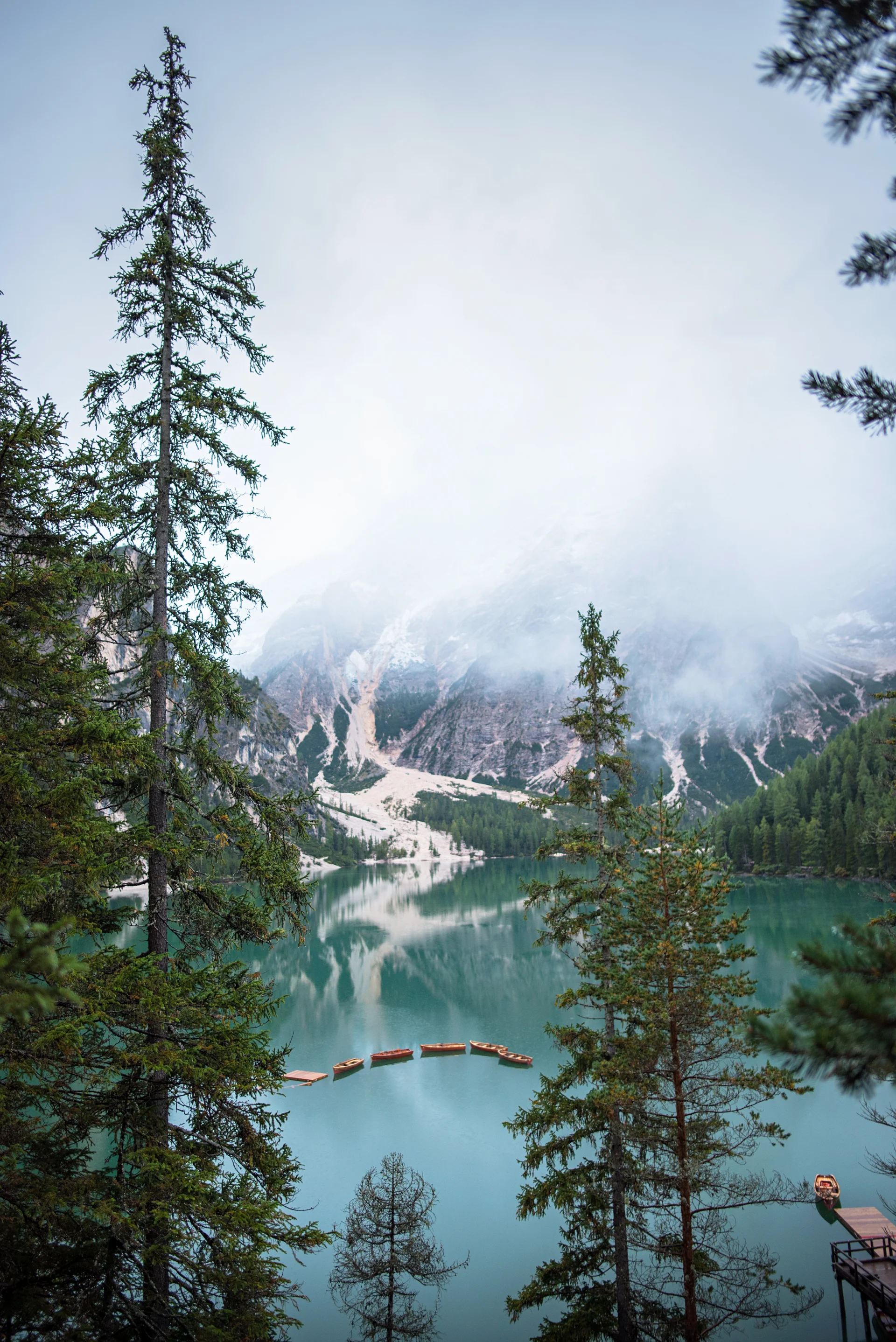 Braies Lake Boats Mountain Dolomites. Nature wallpaper. 4016×6016px. Free download for personal use.