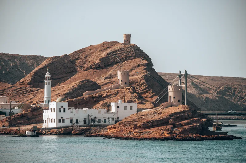 Buildings By Sea Against Clear Sky