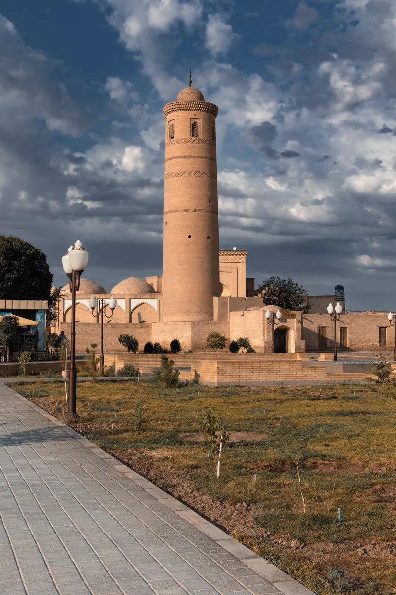 Cityscape With Ancient Palvan Kori Minaret Against Cloudy Sky Khiva Uzbekistan