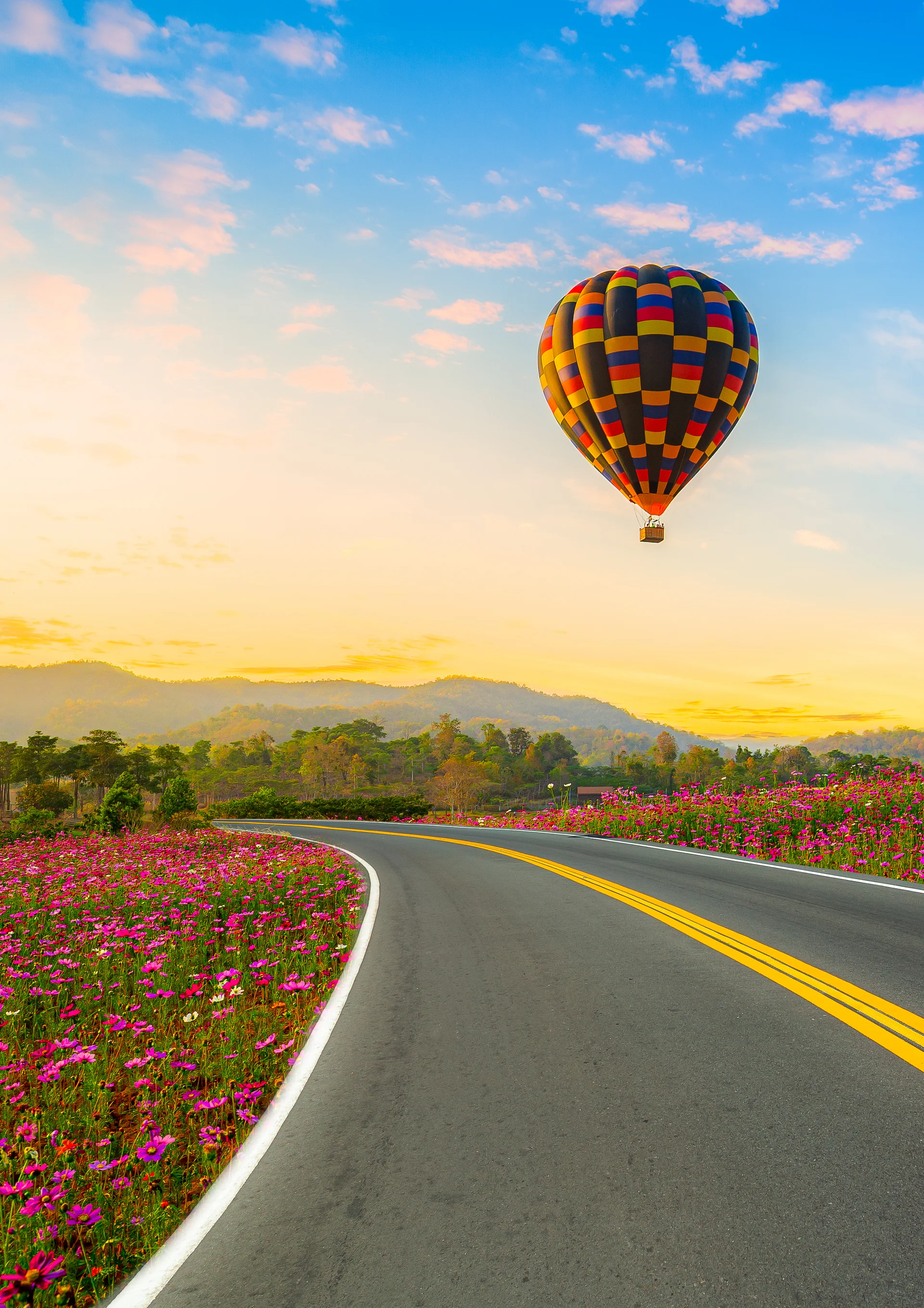 Colorful Hot Air Balloon Flying With Blue Sky Background. Nature wallpaper. 2713×3840px. Free download for personal use.