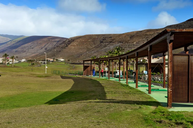 Detail Training Area Golf Practice Field With Mountains Background