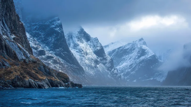 Dramatic Fjord Landscape With Snow Capped Mountains