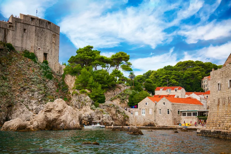 Dubrovnik West Harbor With Fort Lovrijenac Small Houses With Red Roofs Dubrovnik Croatia