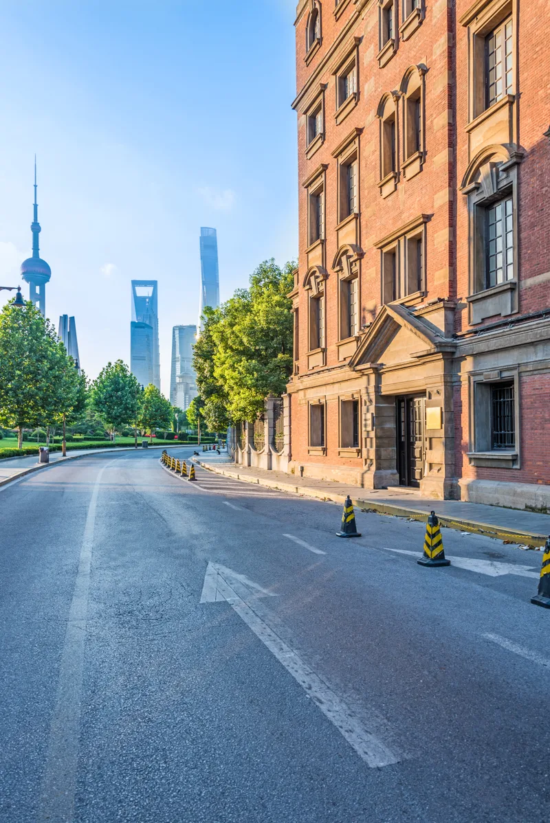 Empty Asphalt Road With Cityscape Skyline