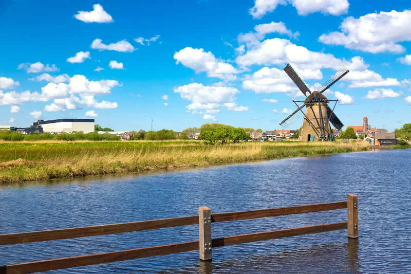 Famous Windmills Kinderdijk Village Netherlands Colorful Spring Rural Landscape With Windmill River Unesco World Heritage Famous Tourist Site