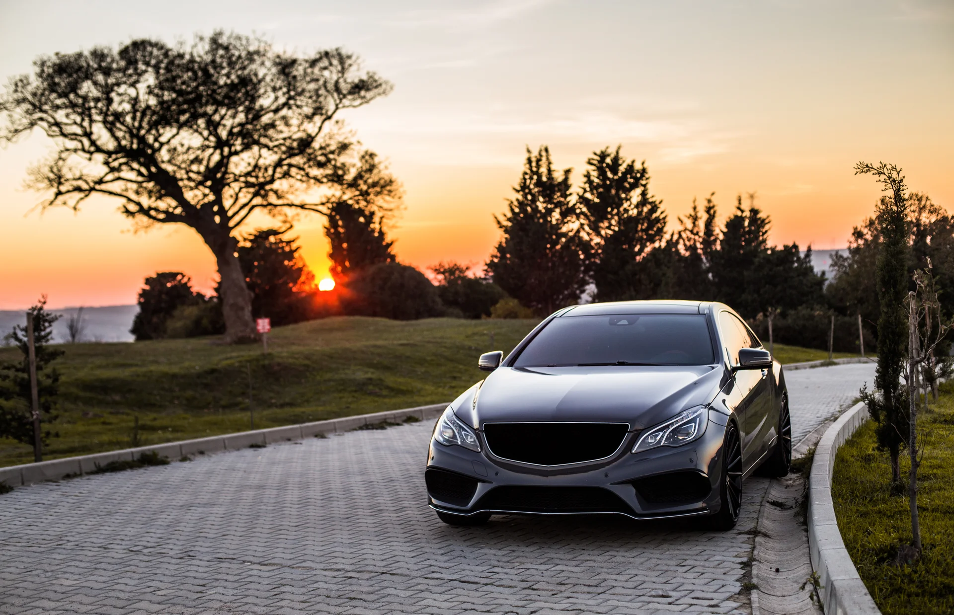 Grey Luxury Sedan Car Sunset. Cars wallpaper. 5357×3454px. Free download for personal use.