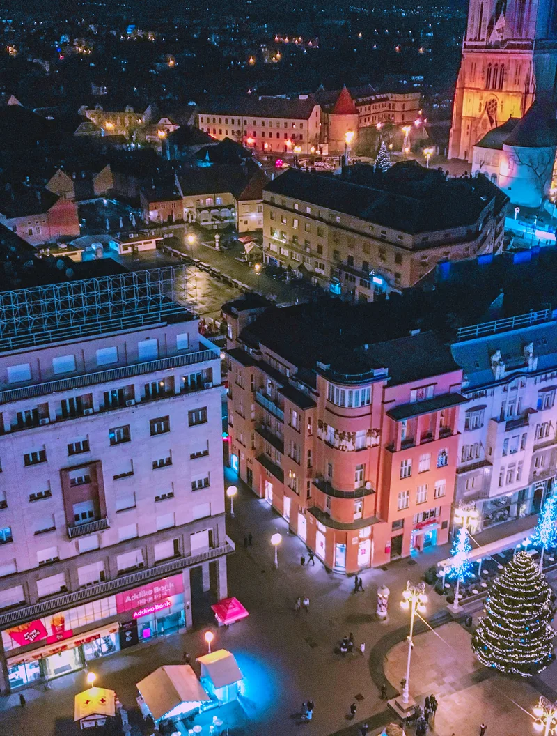 High Angle View Illuminated Street Amidst Buildings Night