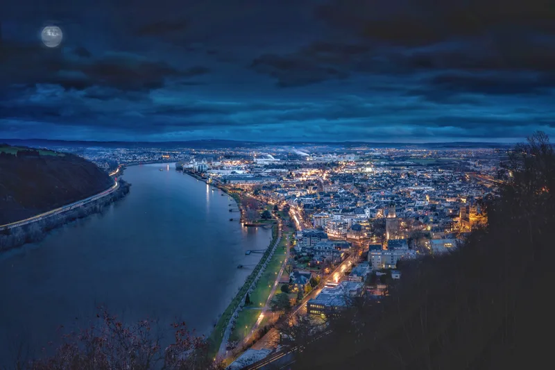 High Angle View River Amidst Buildings City Night