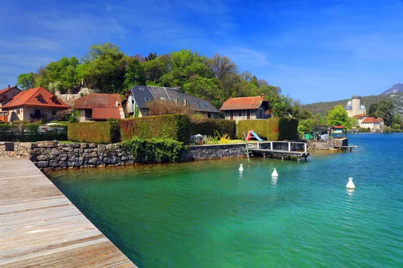 Houses By Annecy Lake Against Sky City