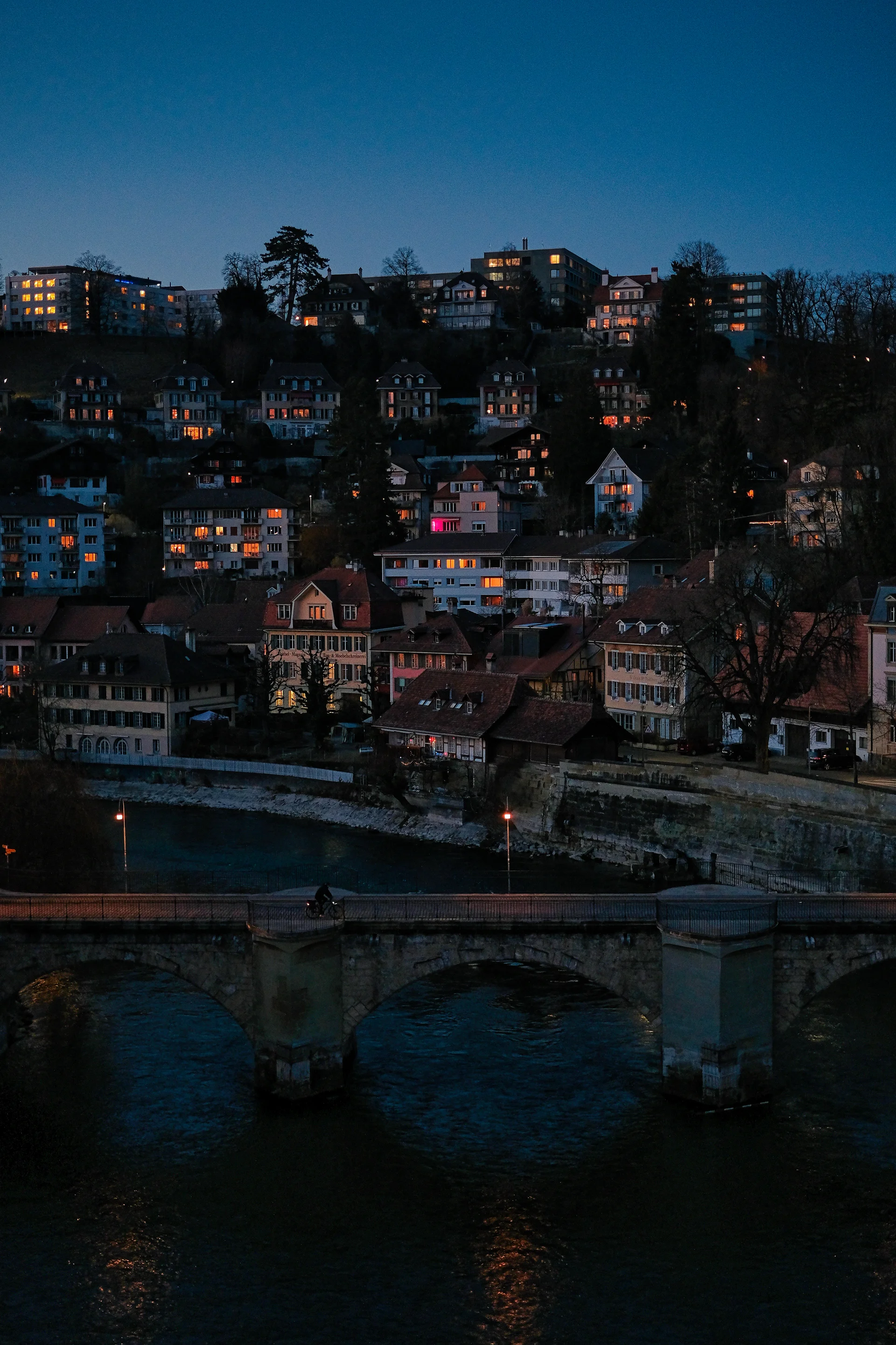 Illuminated Buildings City Night. Cities wallpaper. 4160×6240px. Free download for personal use.