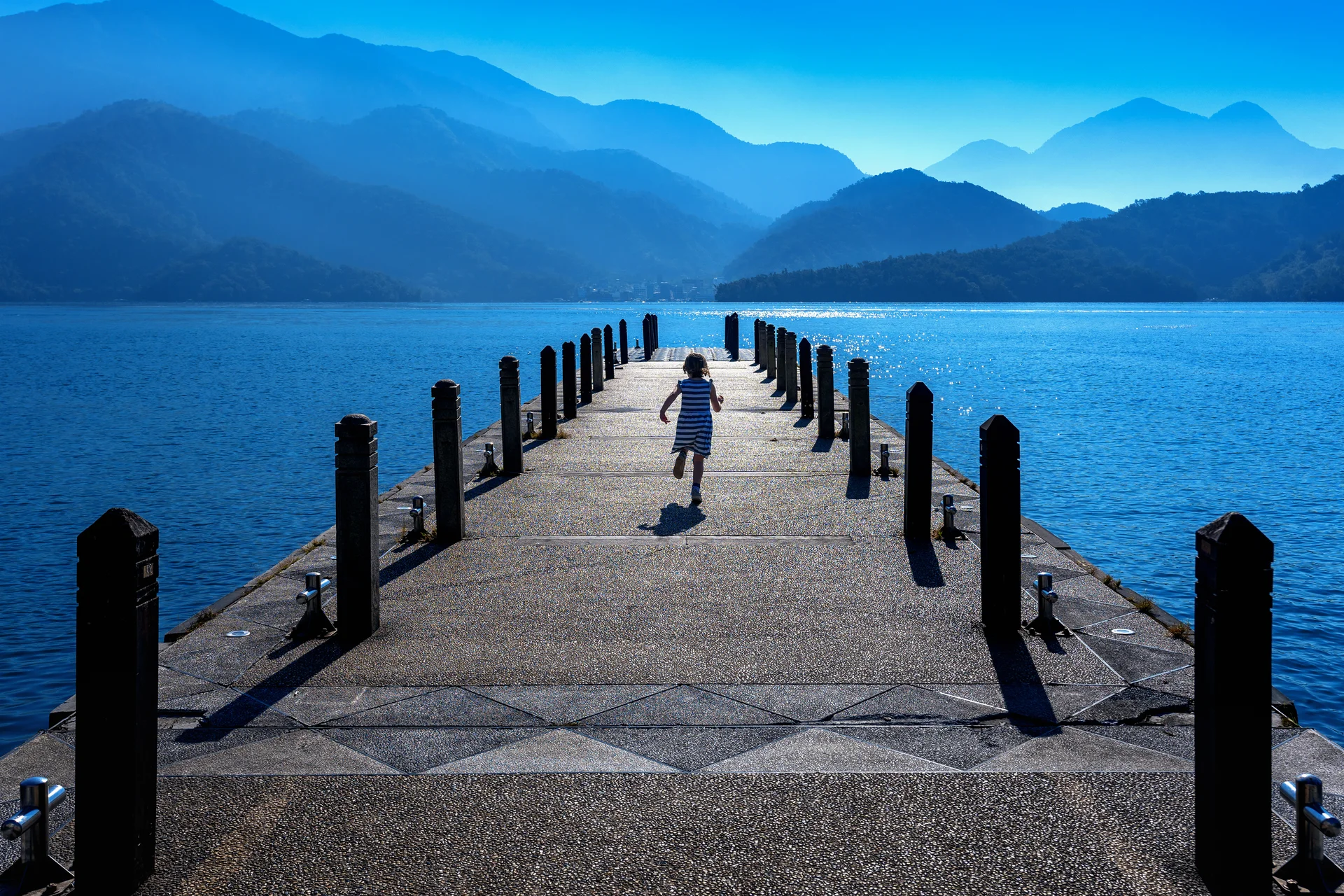 Little Girl Running Pathway Sun Moon Lake Taiwan. Nature wallpaper. 6000×4000px. Free download for personal use.