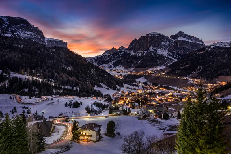 Mesmerizing View Houses Fields Covered Snow Surrounded By Mountains Trees