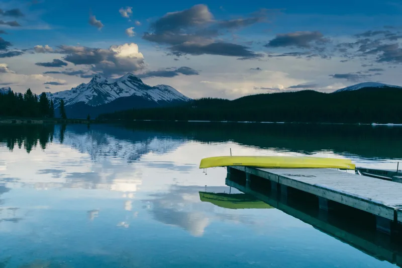 Mesmerizing View Pier Near Lake Surrounded By Lush Nature Mountains