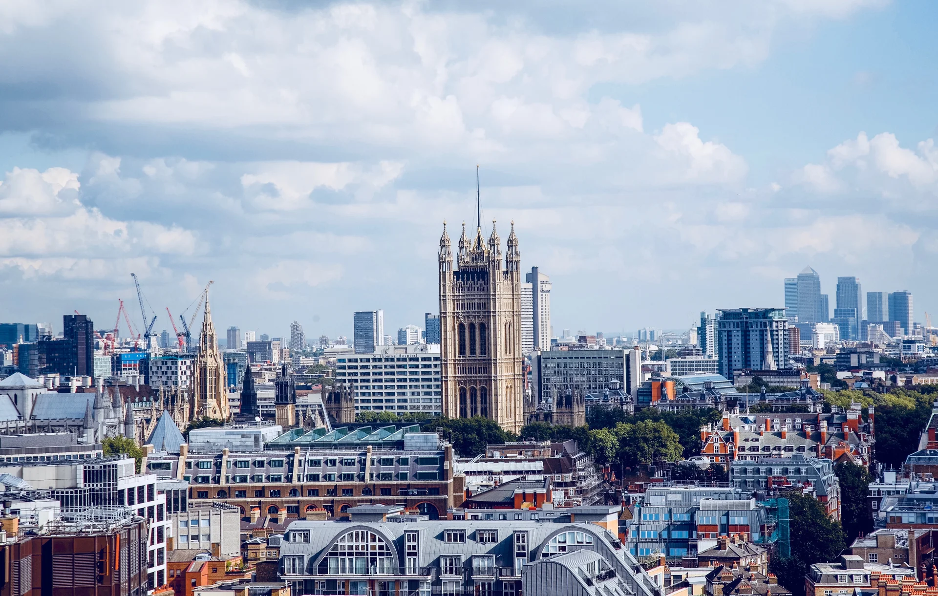 Modern Buildings City Against Cloudy Sky. Cities wallpaper. 4096×2602px. Free download for personal use.