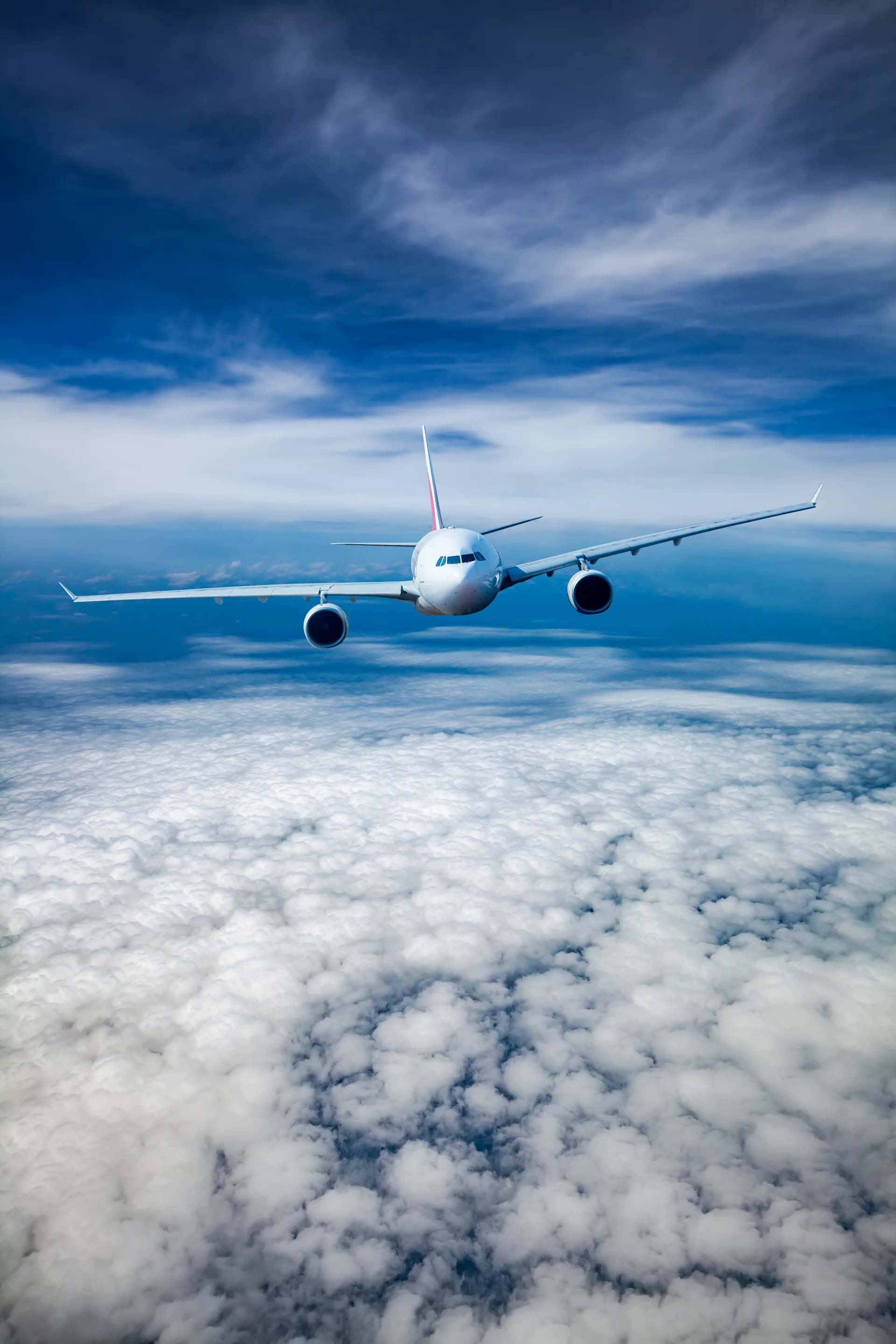 Passenger Airliner Flying Clouds. Nature wallpaper. 3000×4500px. Free download for personal use.