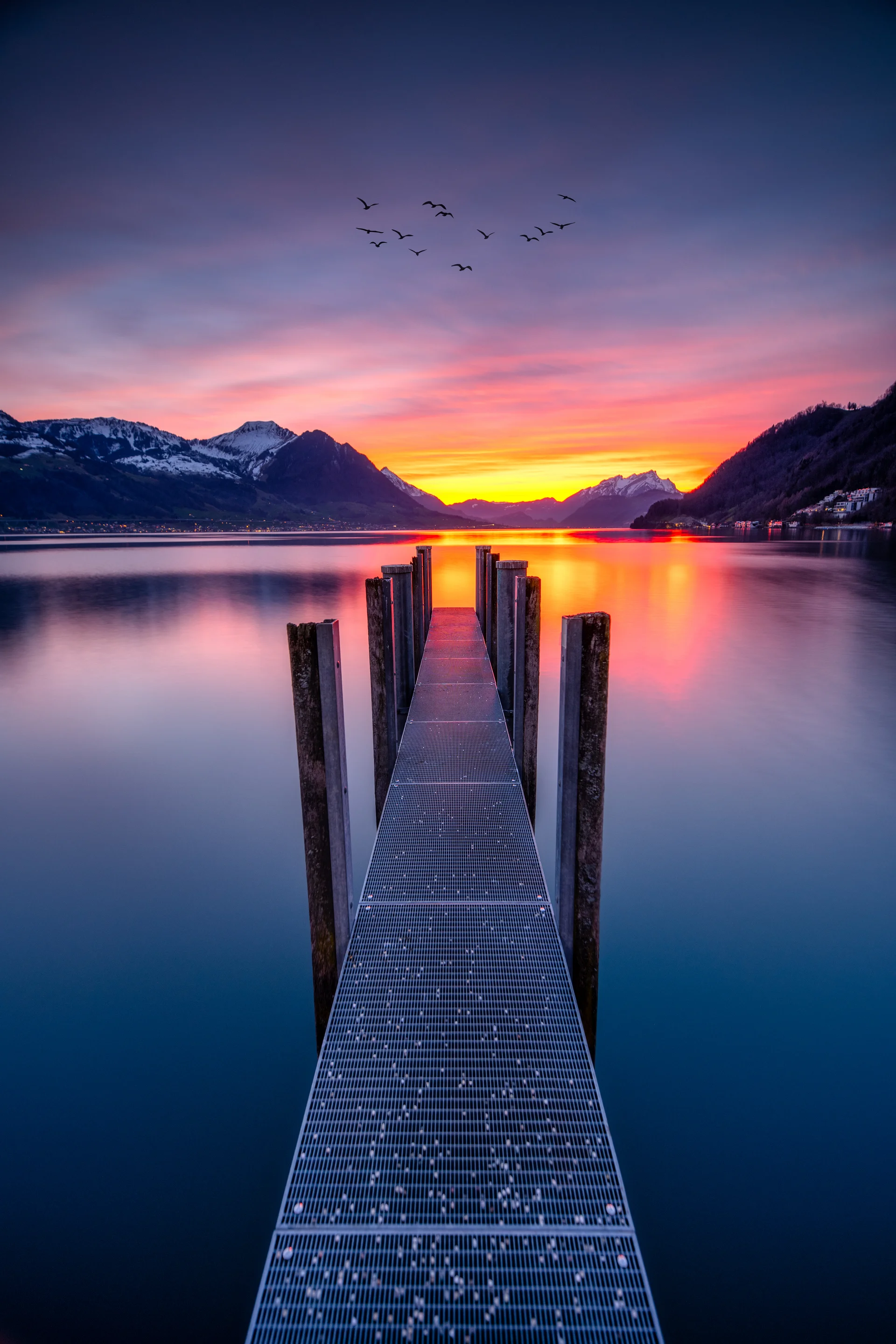Purple Lake Landscape With Mountains Jetty. Nature wallpaper. 5504×8256px. Free download for personal use.