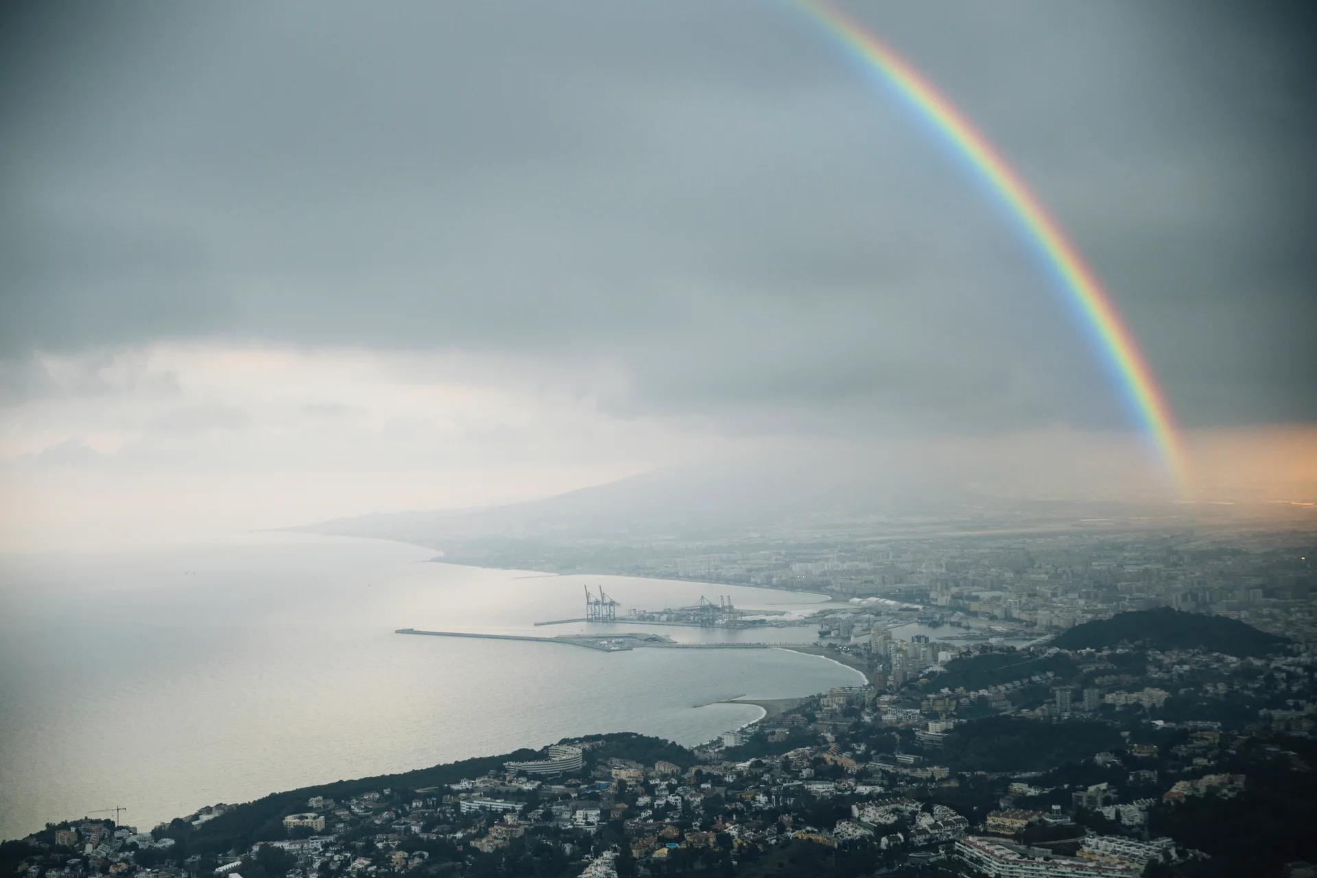 Rainbow Sky With View City. Aerial wallpaper. 7990×5327px. Free download for personal use.