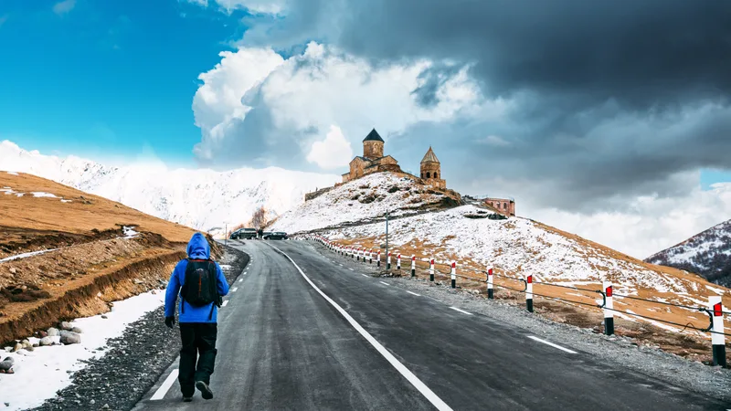 Rear View People Walking Road Against Sky