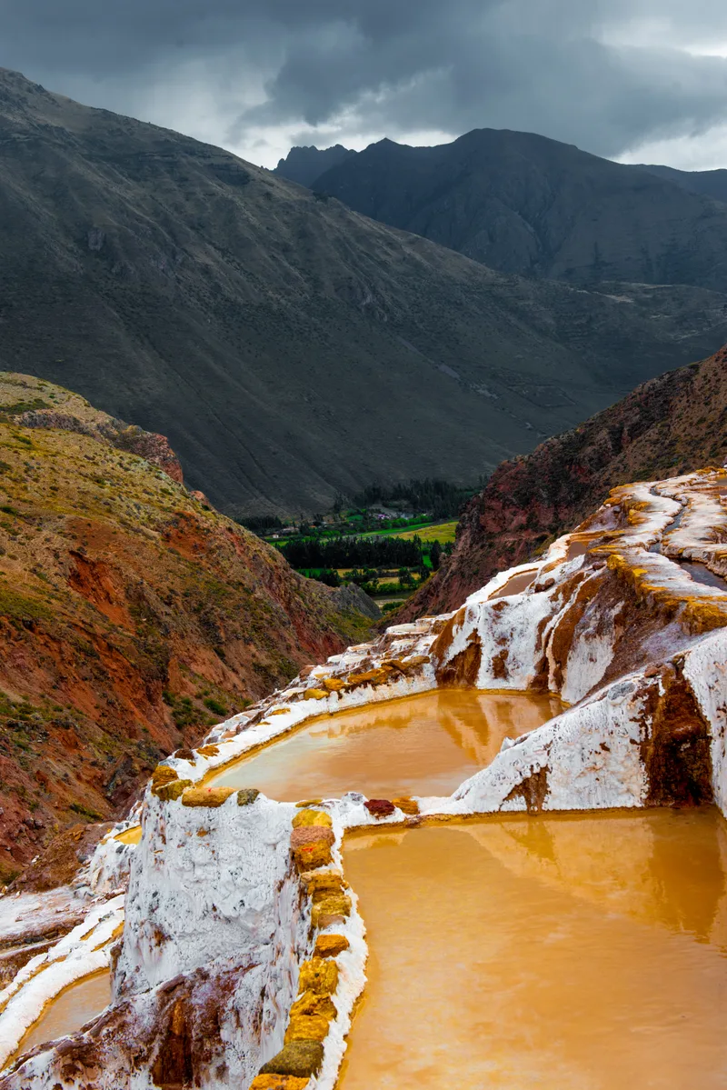Salt Terraces Maras Peru With Mountain Views Vertical Photo