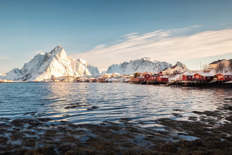 Scandinavian Fishing Village With Snowy Mountain Coastline Reine Lofoten Islands Norway