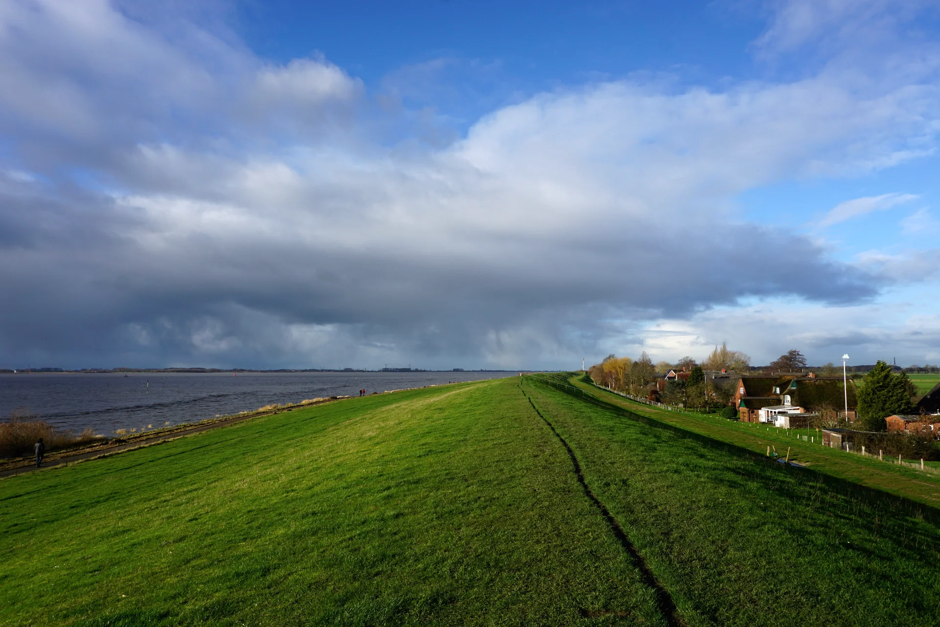 Scenic View Field Against Sky. Nature wallpaper. 5719×3812px. Free download for personal use.