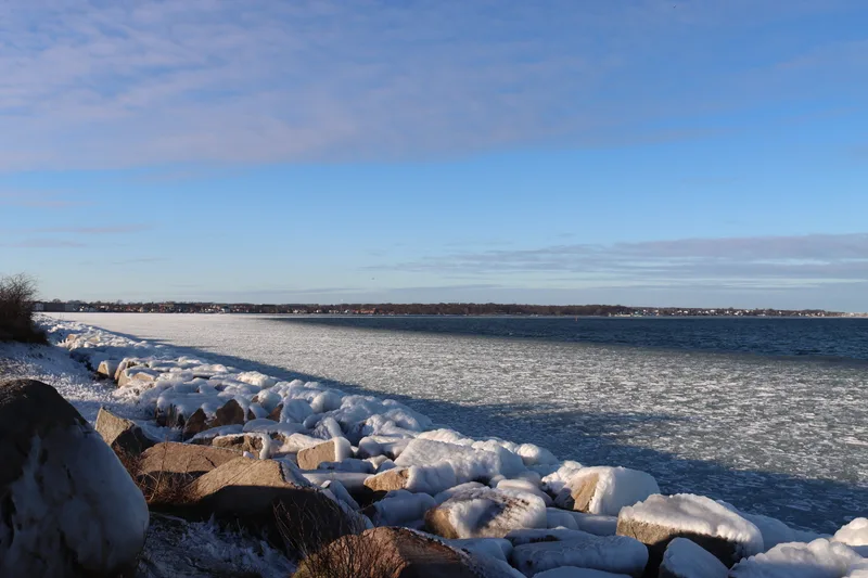 Scenic View Frozen Sea Against Blue Sky