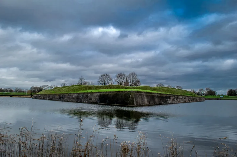 Scenic View Lake Against Cloudy Sky