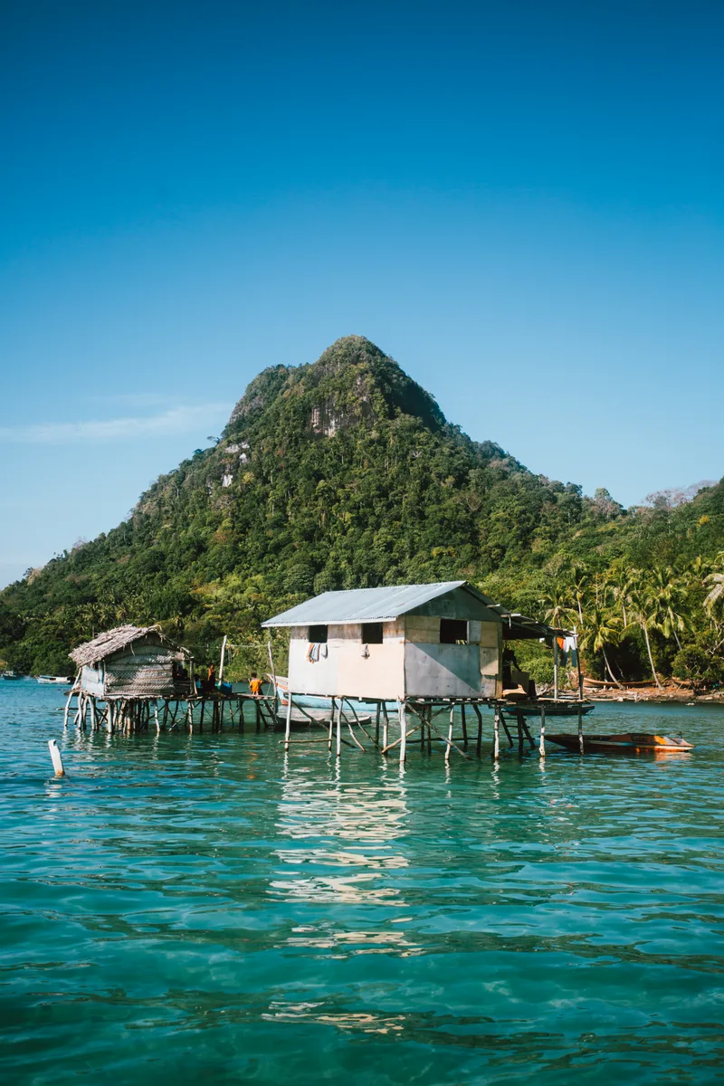 Scenic View Lake Houses Against Blue Sky