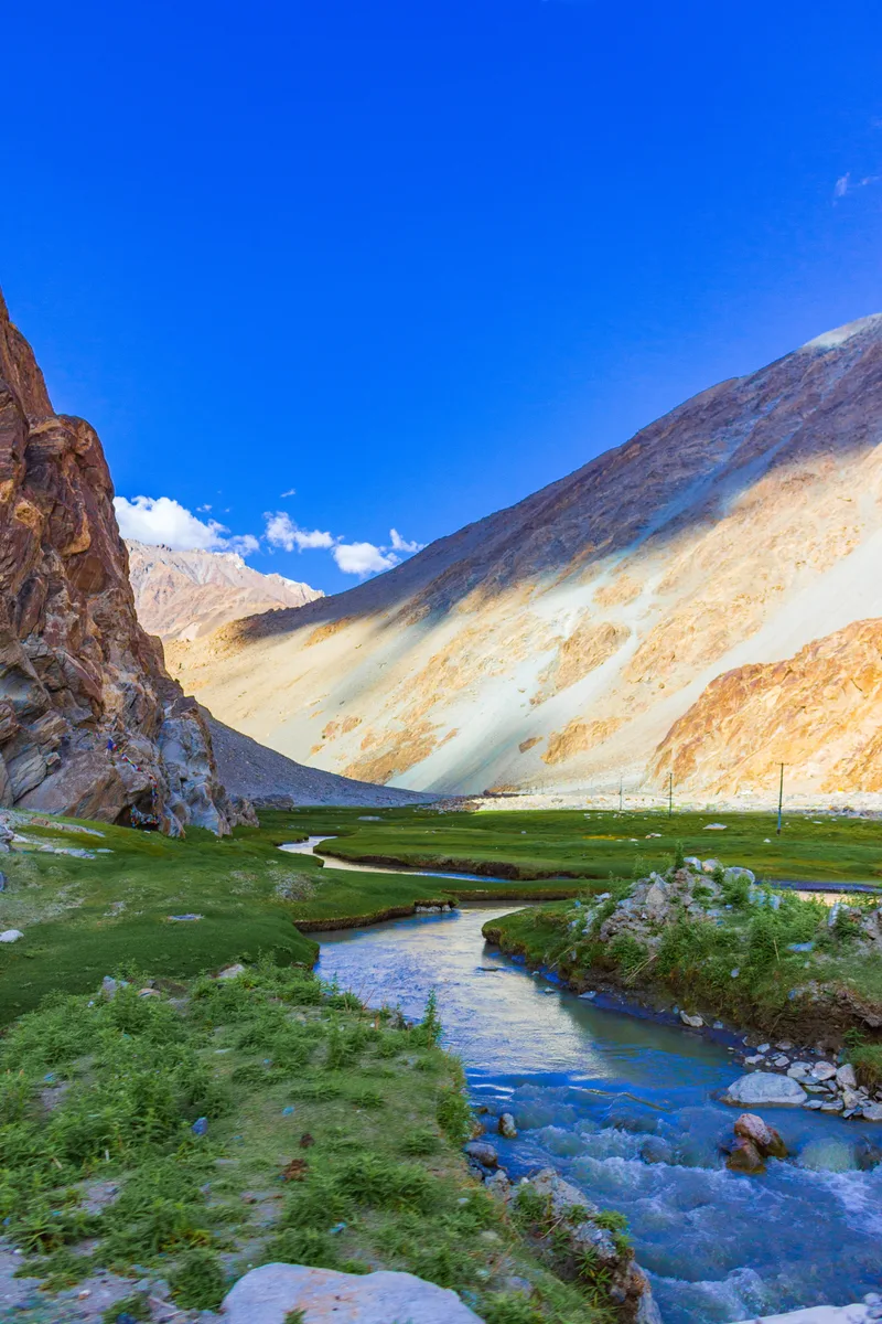 Scenic View Lake Mountains Against Blue Sky