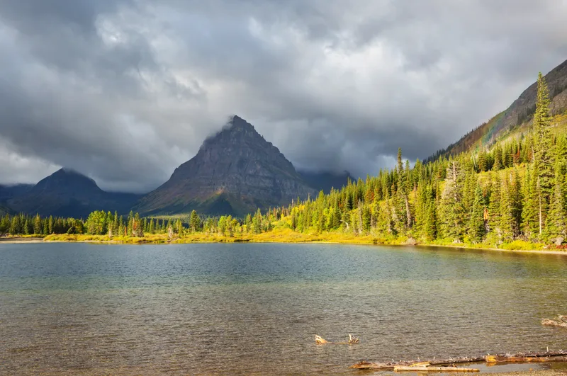 Serene Scene By Mountain Lake Canada With Reflection Rocks Calm Water
