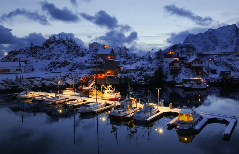 Serene Tranquil Winter Harbor Dusk With Stunning Snowcovered Mountains Surrounding