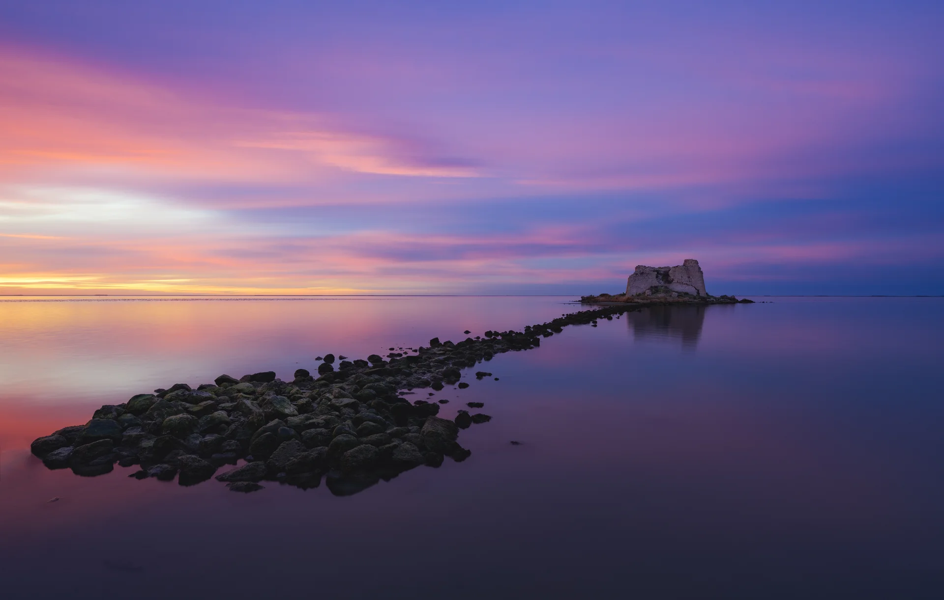 Small Island Middle Ocean Sky Painted With Multiple Colors. Nature wallpaper. 7723×4916px. Free download for personal use.