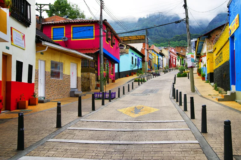 Street Amidst Buildings Town Against Mountain