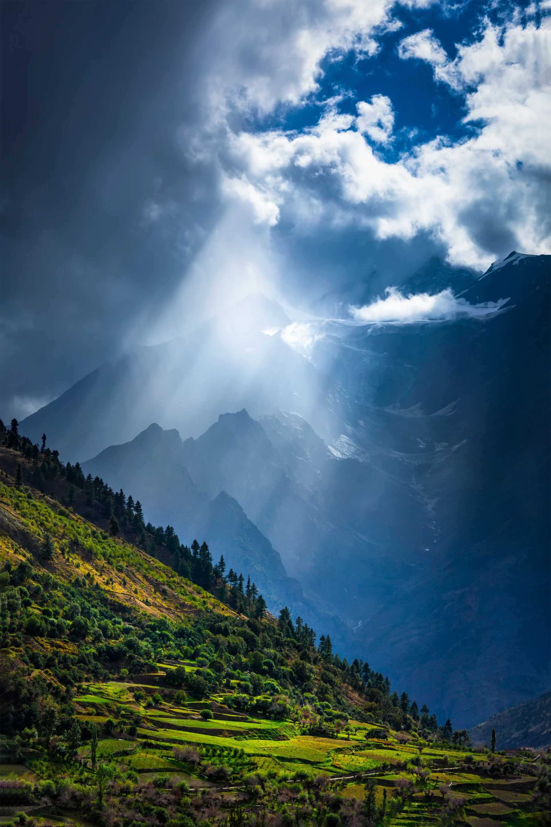 Sun Rays Through Clouds Himalayan Valley Himalayas. Nature wallpaper. 3300×4950px. Free download for personal use.