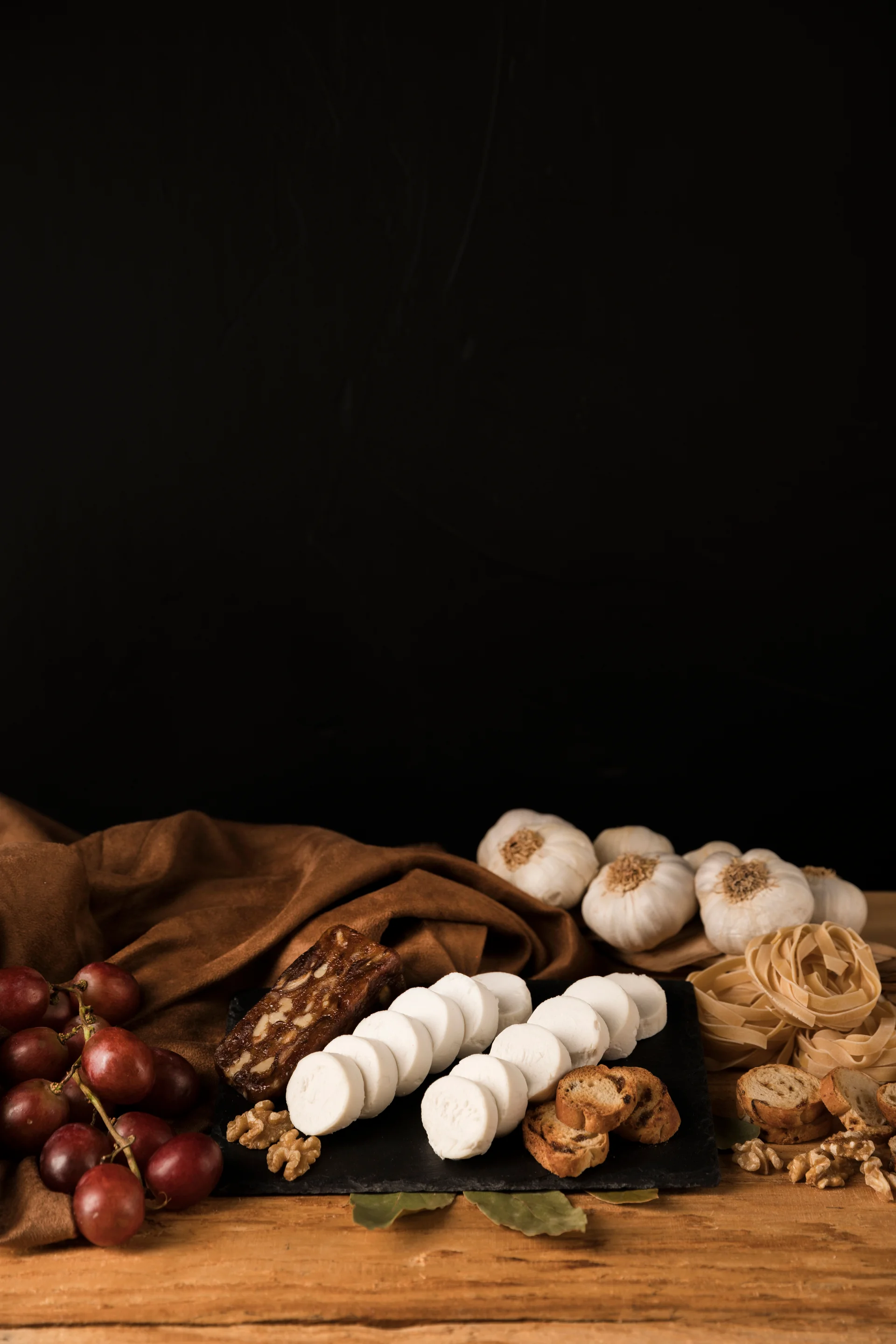 Tasty Raw Food Wooden Table Against Dark Wallpaper. Dark wallpaper. 3989×5983px. Free download for personal use.