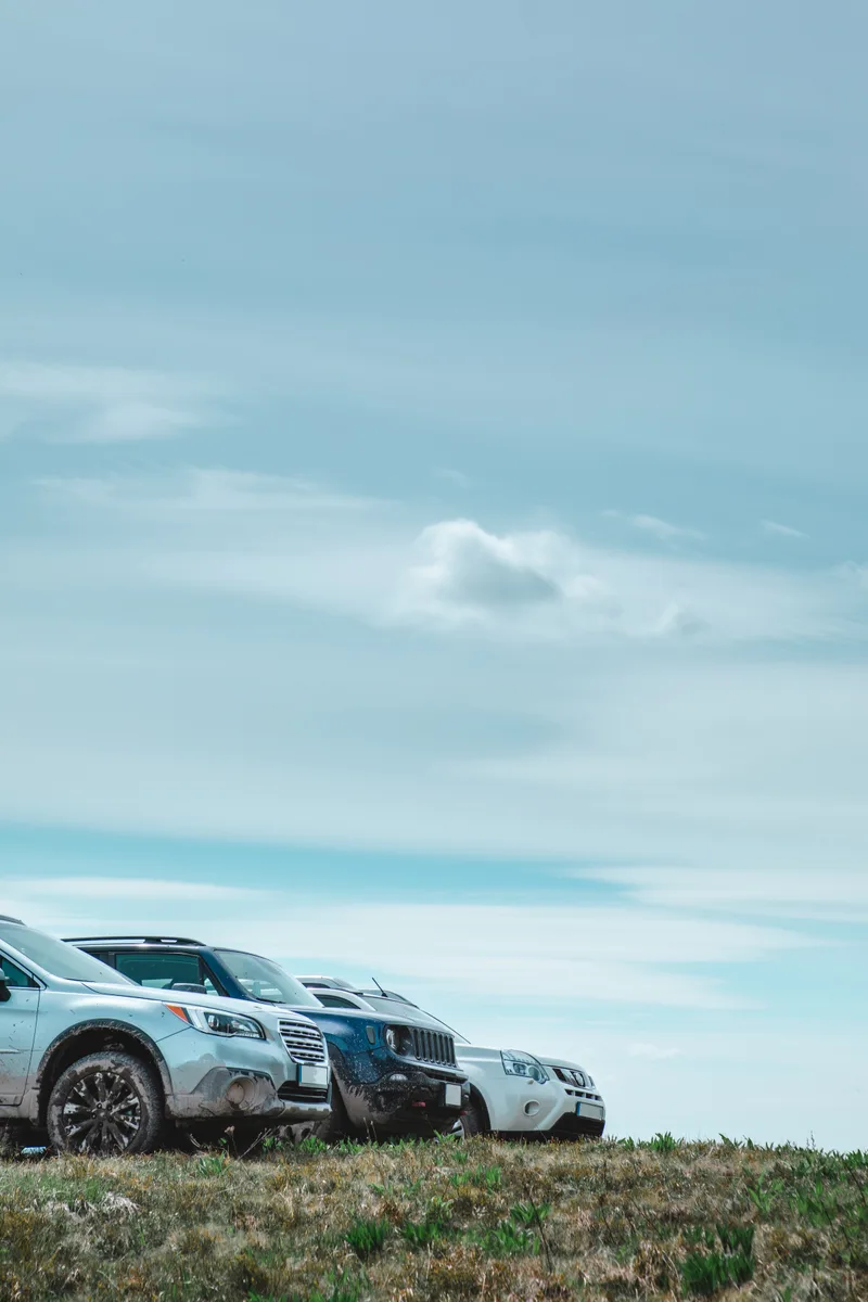 Three Suv Cars Mountains Peak Copy Space Summer Time