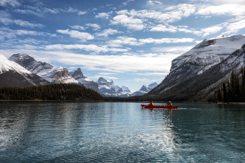 Tourists Canoeing Into Spirit Island With Canadian Rockies Maligne Lake Jasper National Park Ab Canada