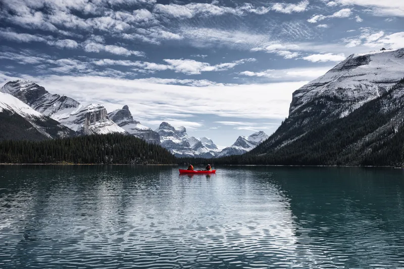 Traveler Canoeing Maligne Lake With Canadian Rockies Spirit Island Jasper National Park