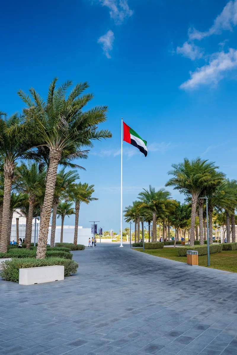 United Arab Emirates Flag Flying Against Clean Tranquil Sky