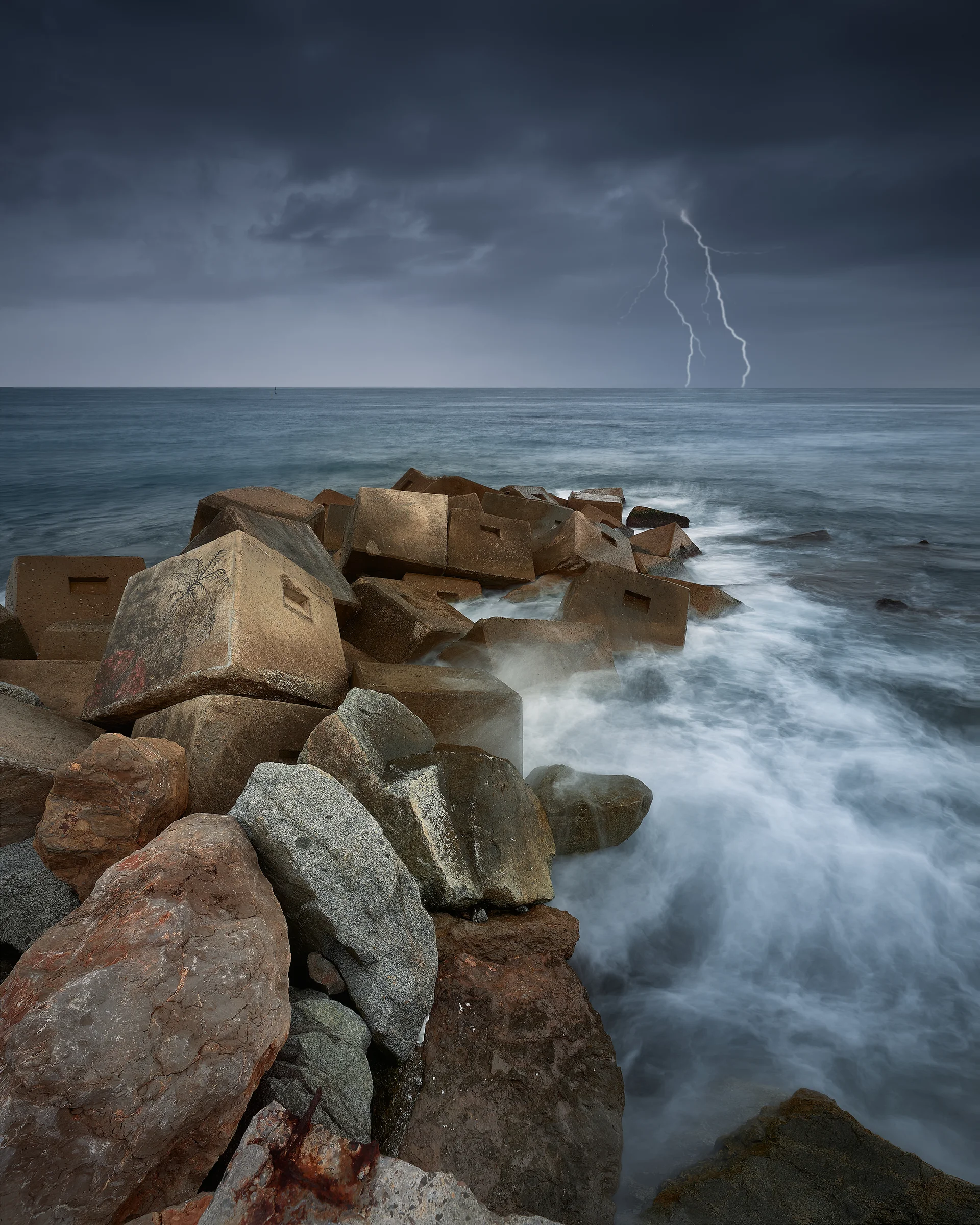 Vertical Shot Rocks Sea Thunderstorm Lightning. Nature wallpaper. 5336×6670px. Free download for personal use.