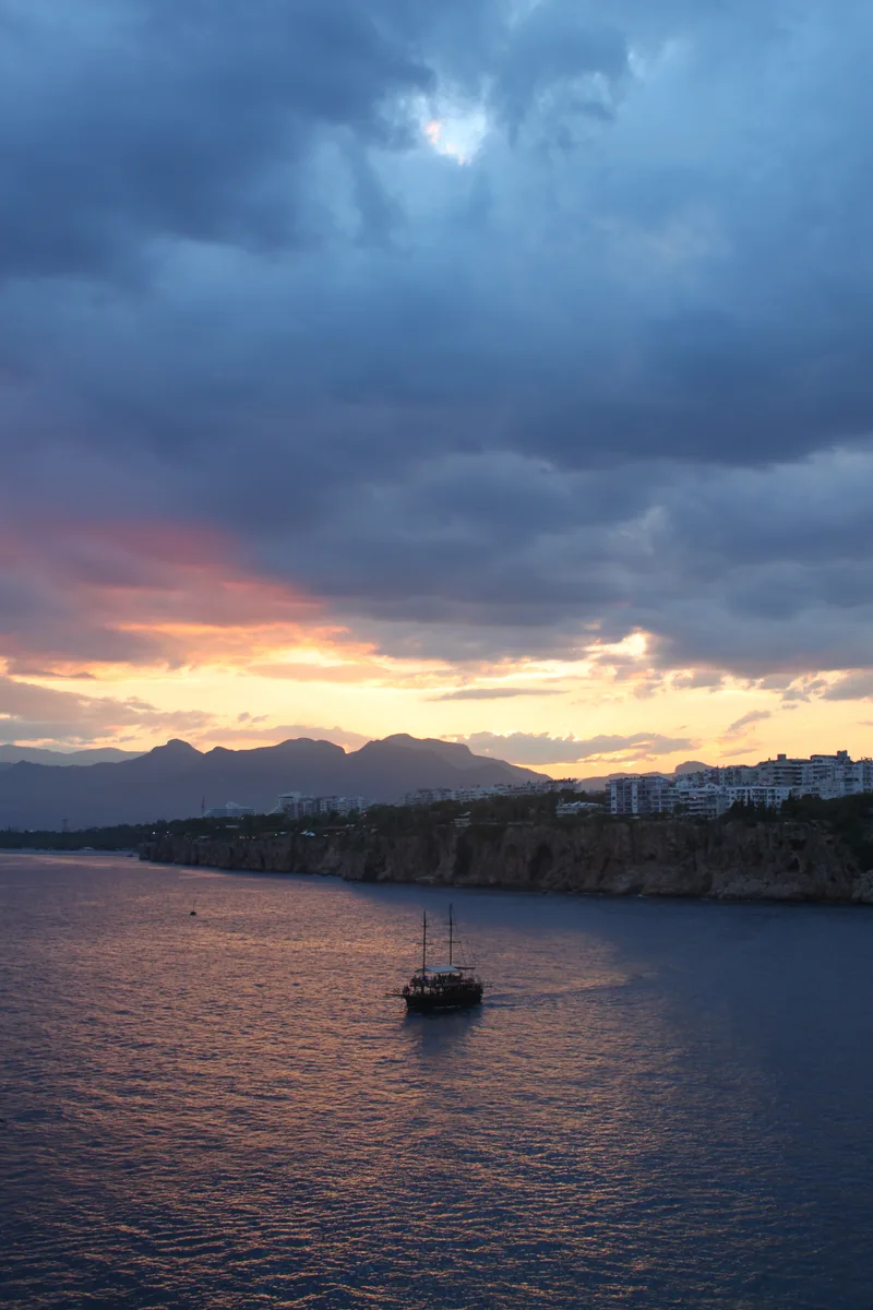 Vertical Shot Single Boat Sea Dark Clouds Sunset